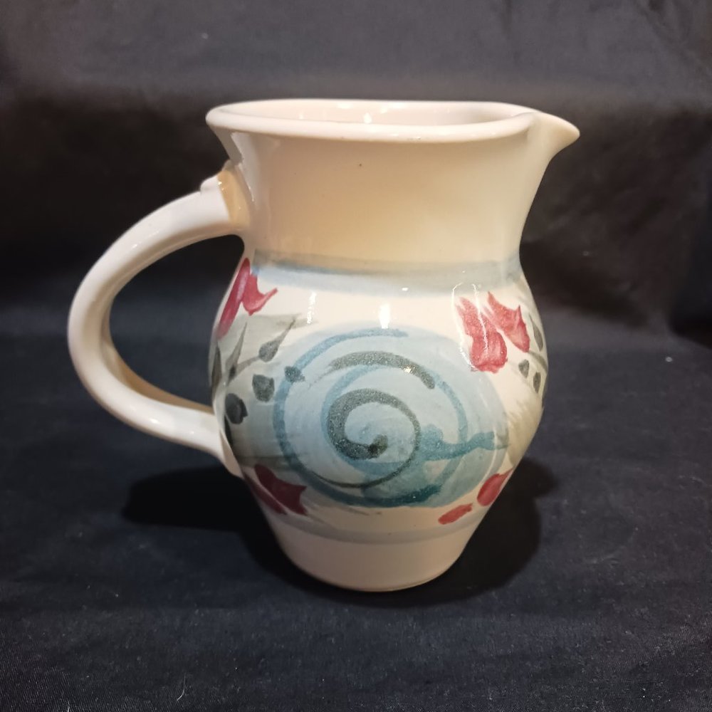 signed art pottery pitcher